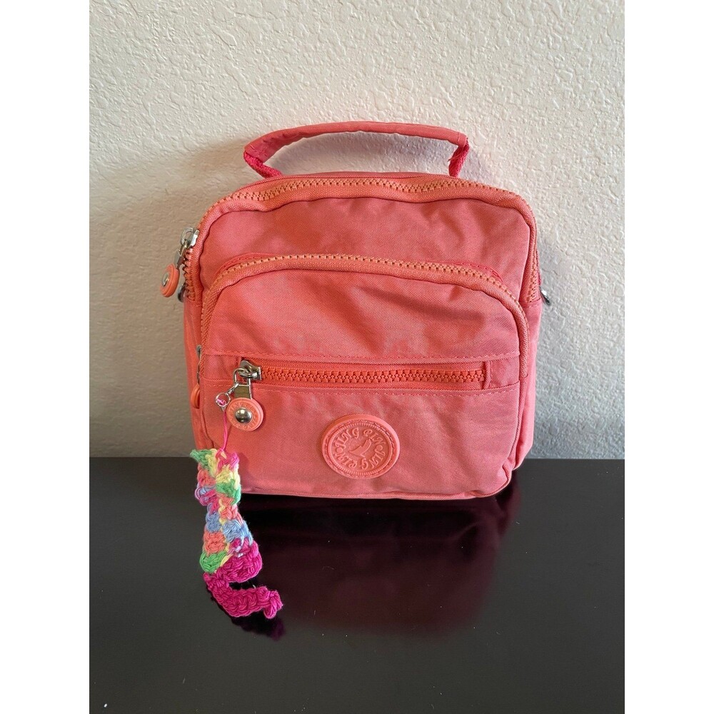 Sherbet orange convertible backpack with charm